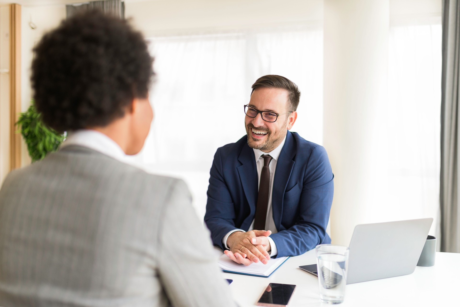 HR manager interviewing young women job applicant