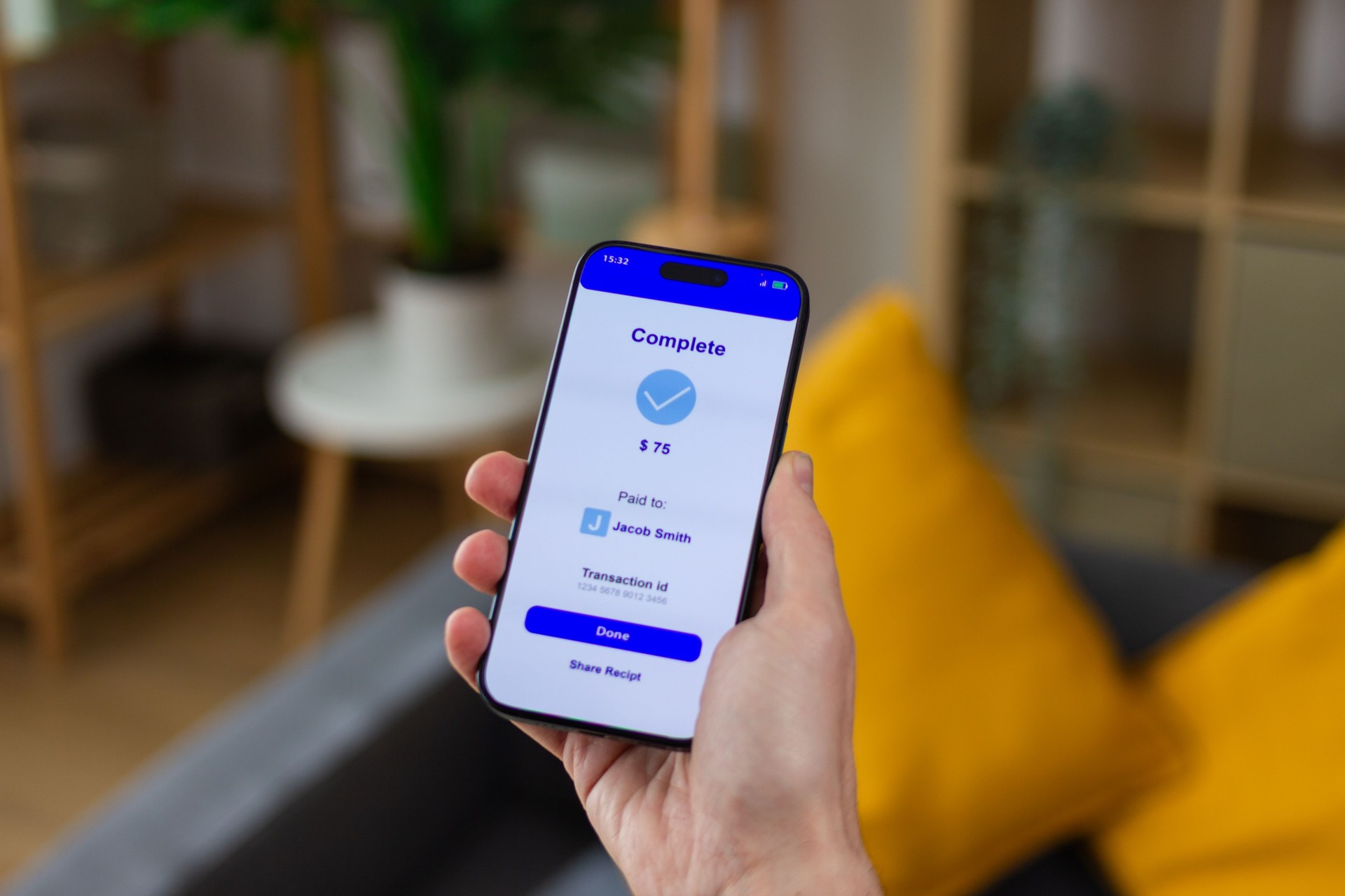 Person holding smartphone showing successful mobile payment confirmation screen